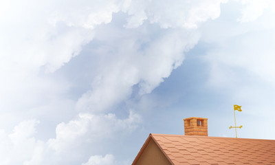 House roof as concept of suburbian real estate and construction. Mixed media