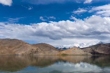 Fototapeta na wymiar The Karakul Lake in the province of Xinjiang in Northwestern China; Concept for travel in China