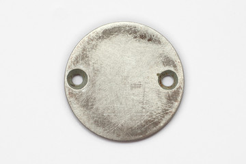 round metal plate/  round metal plate bolted on a light background