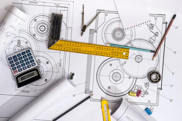 measuring tools on the background of technical drawings. view on top