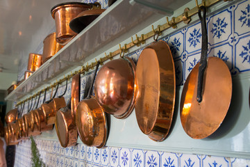 Frying pans in the blue kitchen in the Claude Monet's house, Giverny, France.