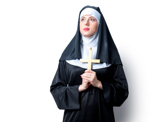 Young serious nun with cross