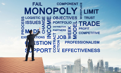 Young businessman standing on house roof and writing leadership 