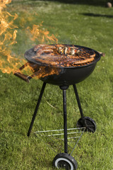 Grill with red hot briquettes, fire background