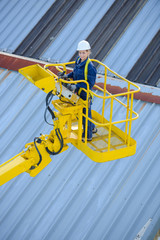 big crane and woman worker on construction site