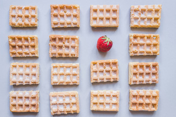 Background of belgian waffles with strawberry on the gray background