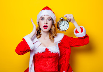 Portrait of Young Santa Claus girl in red clothes