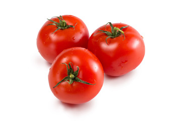 Red fresh tomatoes on a white isolated background