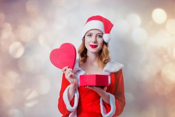 Santa Claus girl with heart shape gift