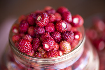 Fresh strawberries in a glass jar
