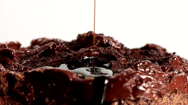 chocolate cake covered by liquid chocolate