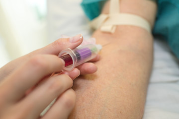 Obraz na płótnie Canvas nurse taking a blood sample close up