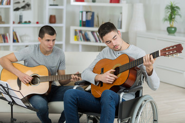 handicapped guitarist and friend