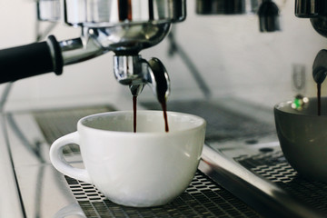 coffee maker and a coffee cup