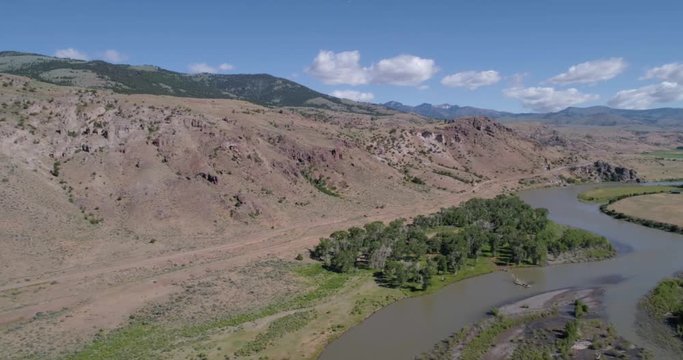 Aerial view of a dirt road and river 4k 24fps