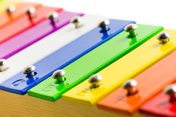 Closeup Detail od Rainbow Colored Wooden Xylophone Isolated on White Background
