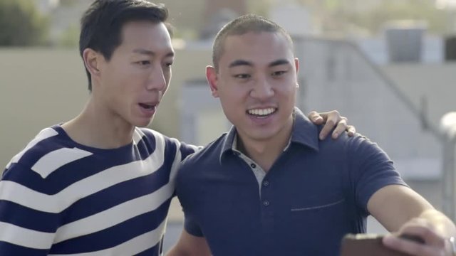 Gay Couple Take A Selfie Together On A Rooftop In San Francisco, Then Enjoy Looking At It