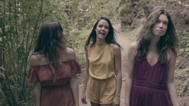 3 Mixed Race Models Walk Through Lush Forest, They Laugh And Then Pose (Slow Motion)