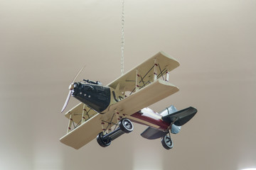 Wooden model airplane on a grey  background