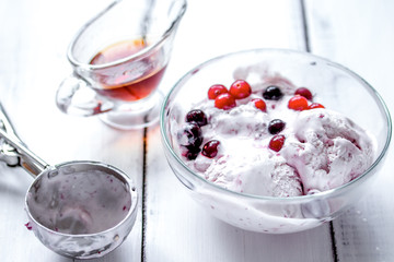 organic homemade ice cream in glass bowl on wooden background
