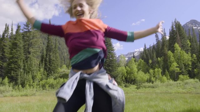 Carefree Teen Girls Practice Cartwheels In Mountain Meadow (Slow Motion)