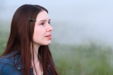 A girl looking into the misty distance with a smile on my face