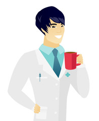 Young asian doctor holding cup of coffee.