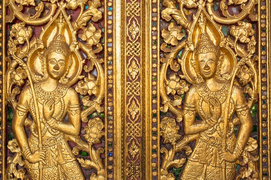 Beautiful golden carving on the door of Wat Sensoukharam temple in Luang Prabang, Laos