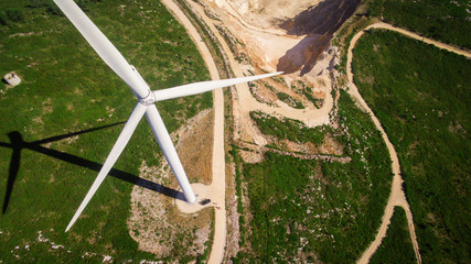 Car under windmills generator on the field, Portugal