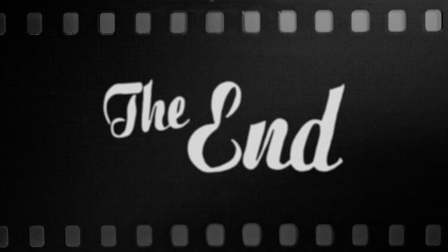 Animation of a retro vintage old fashioned The End title, silent movie ariston style, slowly appearing, over a film strip.
