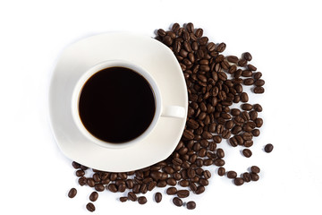 Hand pours instant coffee from a spoon in a coffee cup
