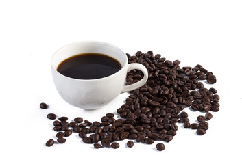 Hand pours instant coffee from a spoon in a coffee cup