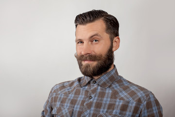 portrait of a young man with a beard and mustache