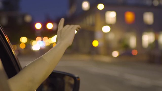 Happy Woman Puts Her Hand Out Passenger Window And Dances Along To Song (Slow Motion)