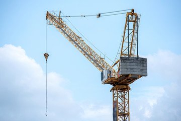 Fototapeta na wymiar Construction crane. Rear part of construction crane. Concrete weights.