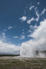 Old Faithful Eruption on a Cloudy Day in Yellowstone National Park, Wyoming