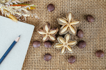 Sacha inchi peanut seed on brown background. To eat as medicine or processed into products.