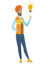 Young hindu builder pointing at light bulb.