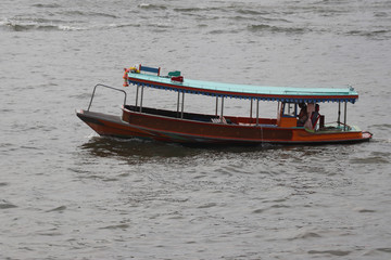 ship floating in river,fisherman driving ship in river