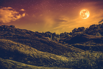 Landscape of sky with many stars and beautiful full moon. Sepia tone.