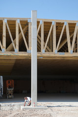 construction site of a supermarket with wooden roof construction