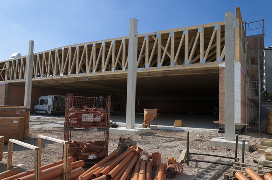 construction site of a supermarket with wooden roof construction