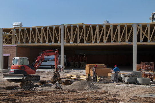 construction site of a supermarket with wooden roof construction