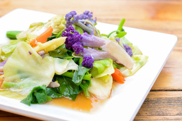 Stir fried mixed colorful vegetables in white plate