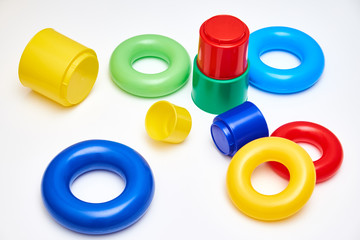 Multi colour toys for kids. Circles and plastic glasses