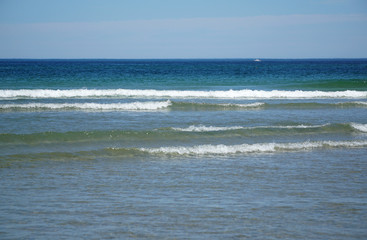 sea waves at beach and blue sky