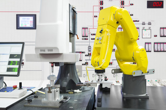 Automated robotic picking automotive part in smart factory, Industry 4.0 concept