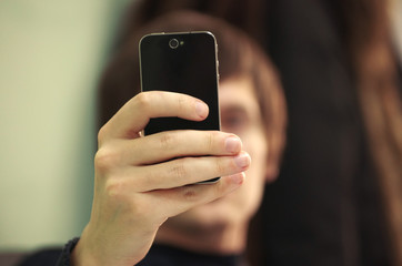 Mobile phone in hand young man