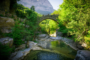  stone bridge of Zagoria. Old bridge in the gorge of Greece
