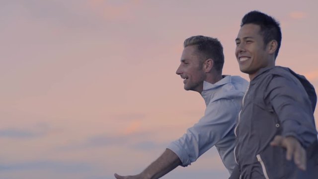 Gay Couple Spread Their Arms Wide, Enjoy The Breeze, Funny Titanic" Moment ""ay Couple Spread"